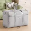 Bolsas de almacenamiento de tela no tejida engrosada para uso doméstico, adecuadas para guardar ropa y ropa de cama, a prueba de polvo y humedad, plegables, ideales para mudanzas, uso en dormitorios y para empacar y almacenar artículos.