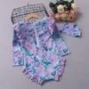 Traje de baño de una pieza para niña estilo nuevo 2026, color lavanda, para usar en verano, para niños pequeños y medianos, con protección solar floral, secado rápido, de manga larga