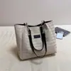 Bolsa de mano de gran capacidad, bolsa de paja para vacaciones, nueva bolsa de hombro de nicho para el día a día, moderna bolsa de playa de verano para mujer