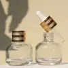Frasco de vidro redondo de 30ml para solução estoque de óleo essencial conta-gotas com cabeça de borracha frasco para sub-engarrafamento essência para cuidados com a pele transparente vazio redondo
