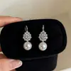 Elegante HerederaEstilo Fresco Bolso de Lunares Plateados Arete Arete Único Mujer 2026 Aretes Súper Hermosos