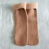 Calcetines cálidos de otoño e invierno para hombre y mujer, calcetines de nieve de imitación cachemira, calcetines de piso acolchados de terciopelo, calcetines de tubo de color sólido con rayas verticales