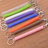 Venta al por mayor de fabricantes Cuerda de resorte de línea telefónica colorida Anti-pérdida Colgante para teléfono móvil Llavero hecho a mano DIY Accesorios de joyería