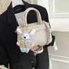 Bolso de Mano Pequeño Súper Popular Estilo Coreano para Mujer Nuevo Modelo 2026 Bolso Kelly de Alta Gama Moderno Bolso Cruzado Versátil