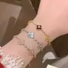 Pulsera de trébol de cuatro hojas de nácar natural con cordón, una pulsera floral lujosa y elegante para mujer
