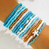 Elegante y moderno set de pulseras de cuentas con bloques de color. Pulseras elásticas con cuentas estilo bohemio con diseño en capas
