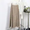 Falda larga de línea A, holgada y adelgazante de cintura alta para mujer en otoño e invierno, falda midi de gamuza elegante y versátil.