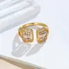 En stock Suministro de Amazon joyería de cobre anillo de circón pulsera moda popular anillo abierto chapado en oro de 18K para mujer