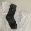 Buenos calcetines coreanos Corea del Sur ins blogger de moda combinación de colores bordado lazo calcetines de canalé niños calcetines Zhuji