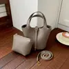 Bolso tote de moda estilo coreano, nuevo bolso de mano para mujer, ligero y lujoso, diseño de nicho con un toque de alta gama, bolso cubo, bolso de hombro y bolso cruzado