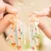 Pendientes Largos de Borla con Flor de Perlas "Verano Fluido" Ipink / Clips para Orejas para Mujer, Estilo Vacacional, Efecto Adelgazante