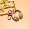 Nuevo llavero creativo de auriculares 3D, un accesorio moderno y genial para bolsos, joyería hecha a mano para manualidades y materiales para accesorios, al por mayor