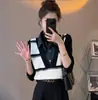 Diseño de combinación para principios de otoño Chaleco de punto de mezclilla para mujer Moda otoño e invierno 2023 top chaleco pequeño