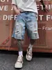 Jeans de Verano para Hombre 2026 con Diseño Roto de Seis Puntos y Salpicaduras de Pintura, Estilo Vintage, Jeans Amarillos de Tinte de Barro de Moda para Verano que Llegan por Encima de la Rodilla