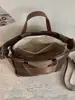 Shuai Mi Jia bolsa de mano de gran capacidad 2026 nuevo color de moda a rayas de bloques de color para el día a día bolso de hombro artístico estilo francés
