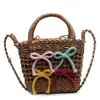 La popular bolsa tejida a mano de este año para mujer 2025 verano nuevo bolso de mano nicho bandolera cubo de paja