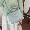 Outono 2026 Feminino Exquisito Novo Crossbody Moda para o Trabalho Padrão Tecido Jovem Coreano Bolsa de Ombro Único Estilo Balde