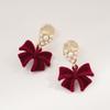 Hermosos pendientes de lazo rojo de perla para mujer, con clip para la oreja en espiral antimosquitos, pendientes sin orejas, modernos y elegantes para otoño e invierno.