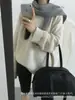 Nuevo suéter de estilo coreano, corte relajado, cuello redondo para mujer, perfecto para otoño e invierno, con un tejido suelto, grueso y suave, y un diseño simple y versátil que se puede combinar fácilmente con otros atuendos.