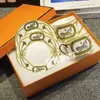 Suministro directo transfronterizo Juego de taza de café H de moda Juego de té de la tarde europeo taza de té negro café 2 tazas 2 platos caja de regalo