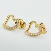 Moda europea y americana versátil aretes de titanio con circonita microincrustada en forma de corazón aretes de acero inoxidable de lujo ligero de alta calidad