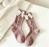 Meias femininas novas, fofas e quentes, personalizadas, cor sólida, meias de algodão de malha dupla únicas para outono e inverno, meias de cano médio estilo coreano