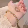 Conjunto de Pulseira e Anel Geométricos de Zircônia Personalizado e Fashion para Mulheres, com um Toque de Luxo Leve e Acabamento de Alta Qualidade, Conjunto de Pulseira Aberta