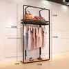 Perchero moderno simple de piso estante multicapa simple estante para ropa de mujer soporte de exhibición de ropa de hierro venta al por mayor