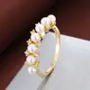 Anel de Pérola com Zircônia de Venda Quente Transfronteiriça Coroa de Flores de Zircônia Cravejada com Quatro Garras Anel Redondo com Várias Pérolas Venda Direta da Fábrica