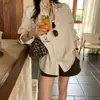 Moda feminina de alta qualidade de Dongdaemun, Coreia, outono de 2026, blusa de camisa com bolso duplo e corte solto estilo coreano