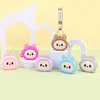 Bolsa de monedas de silicona de dibujos animados al por mayor, llavero colgante, funda para auriculares, mini bolsa de almacenamiento, muñeco llavero bolsa colgante