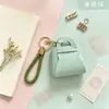 Colgante de monedero pequeño de color caramelo lindo estilo coreano, monedero, llavero, bolsa pequeña plegable de mano estilo macarrón creativo