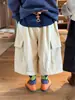 Otoño 2026 Nuevo Estilo Pantalones de Pana de Pierna Ancha con Bolsillo Lateral para Niños Versión Coreana Unisex Modernos Versátiles Pantalones Cortos de Moda