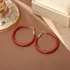 Pendientes Retro Estilo Hong Kong Esmalte Goteado Borgoña de Gama Alta Otoño e Invierno Nuevos Pendientes de Aro Lisos Diseño de Nicho Pendientes de Moda