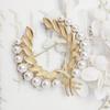 Joyería de Qingdao Broche retro dorado mate perla de trigo de alta gama Atmósfera Joker Accesorios de ropa Venta al por mayor