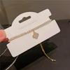 Pulseira doce pequena de flor de quatro pétalas micro-incrustada estilo ins cordão requintado diamante completo de alta qualidade corda de mão joia feminina