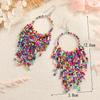 Pendientes de borlas con cuentas de arroz largas estilo étnico bohemio retro, joyería popular europea y americana, suministro transfronterizo para mujer