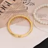 Pulseira de ouro estilo europeu e americano para mulheres, acessório de braçadeira aberta exagerada, joia de braçadeira prateada metálica brilhante