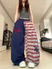 Pantalones deportivos casuales de bloques de color a rayas estilo americano para hombres y mujeres, cintura elástica de otoño con diseño de cordón, caída deportiva, pantalones versátiles de pierna recta
