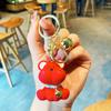 Nuevos accesorios de resina con dibujos animados para llaves pequeñas, regalo creativo para niños, bolso escolar, pequeño colgante, llavero de coche para mujer, venta al por mayor