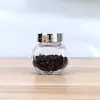 Venta al por mayor de fábrica Botella Transparente de Tambor Plano para el Hogar Sellada a Prueba de Humedad Tarro de Almacenamiento para Cereales y Frutas Secas Tarro de Almacenamiento de Vidrio Embotellado