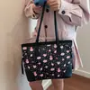 Bolsa de mão de grande capacidade para mulheres, nova moda primavera 2026, bolsa de ombro simples, bolsa tote estampada fofa para o dia a dia
