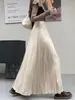 Elegante saia plissada de cintura alta estilo retrô para mulheres, novo estilo para o início do outono de 2026, saia plissada de corte A que afina a silhueta e é estilosa, com barra larga