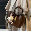 2025 Nuevo Otoño e Invierno Retro Textura Simple Versátil Portátil Bolso Cubo de Viaje Nicho de Moda Bolso Cruzado para Mujer