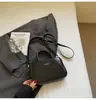 Bolsa de mão retrô da moda para mulheres, nova popular da primavera de 2026, bolsa quadrada pequena casual simples para ombro ou transversal