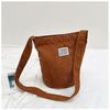 Estilo coreano corduroy pano sólido cor saco pequeno das mulheres textura simples commuter shoulder bag grande capacidade casual bucket bag