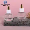 Botella de aceite esencial de 30 ml en stock, estilo popular, botella cuentagotas de vidrio corta y de fondo redondo de 15 ml para líquido de esencia, material de embalaje