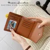 Cierre de cremallera ~ nueva cartera corta plegable para mujer al por mayor de alta gama diseño de nicho cartera de tela de moda