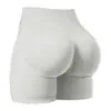 Shorts de fitness para yoga sin costuras de alta elasticidad transfronterizos para realzar glúteos color durazno, pantalones de yoga deportivos de tres puntos para mujer de cintura alta para realzar glúteos