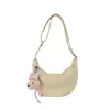 Bolsa de Ombro de Couro Macio Estilo Coreano Fashionável de Grande Capacidade para Mulheres, Novo Modelo Primavera 2026 com Pingente, Bolsa de Axila Ins Bolsa Dumpling